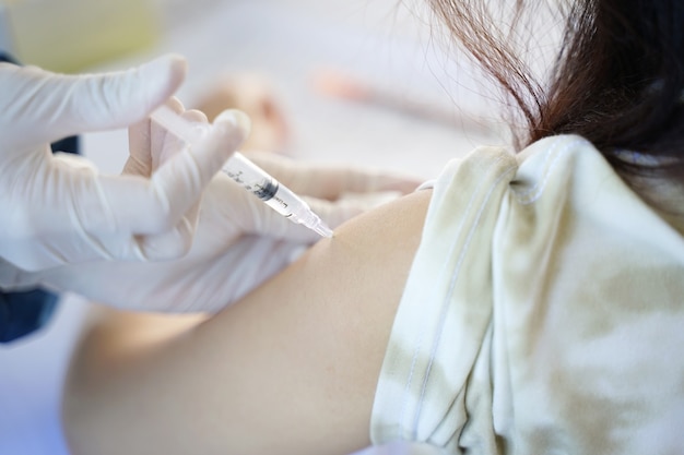 Young asian male getting vaccinated with sinovac vaccine Against Coronavirus