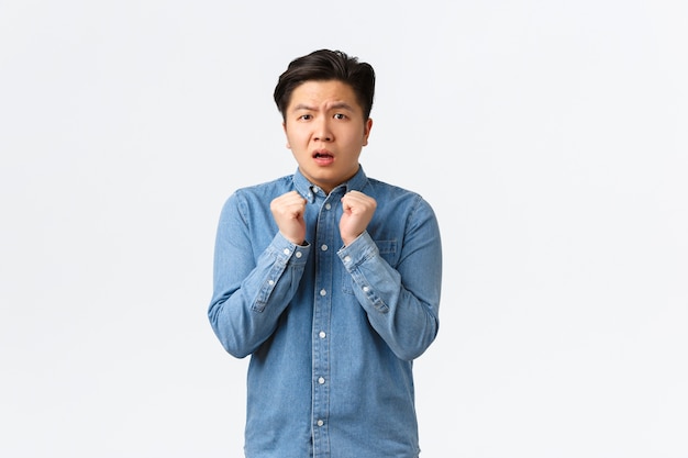 Young Asian man posing in the studio