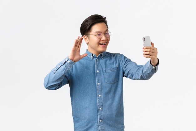 Young Asian man posing in the studio