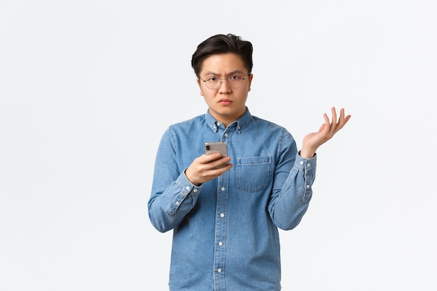 Young Asian man posing in the studio