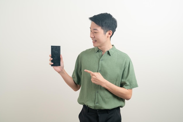 young Asian man using or talking smartphone and mobile phone on white background