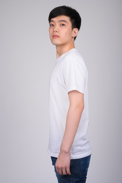 young Asian man on white