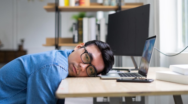 Young Asian man working at office