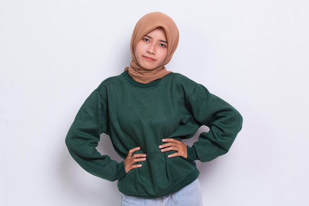 Young asian muslim woman using hijab scarf smile with arms crossed on white background