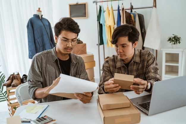 Young asian people businessman chatting about product of packaging