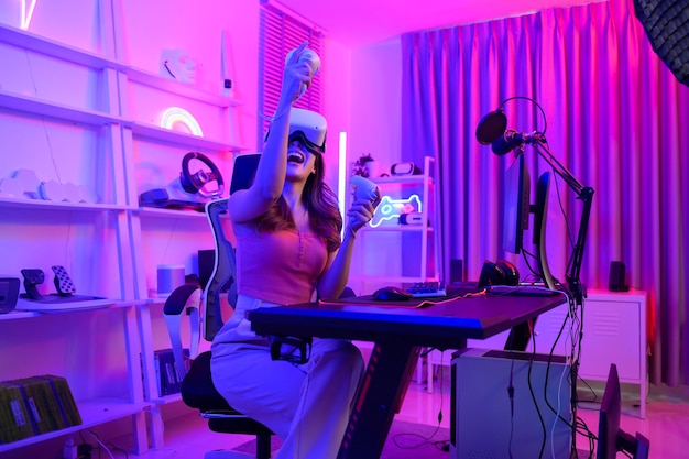 Young Asian pretty woman Pro Gamer have live streaming playing video game using virtual reality