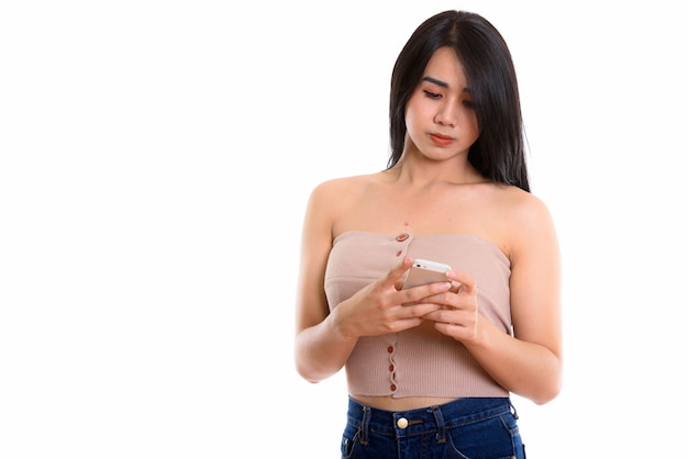 young Asian transgender woman using mobile phone