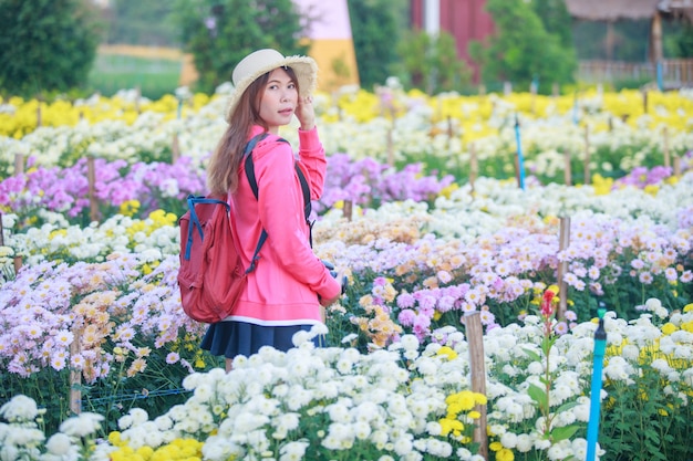 Young Asian woman in the chrysanthemum garden.