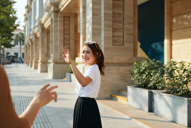 Young asian woman good bye to boyfriend freedom lifestyle and relaxation on holiday concept