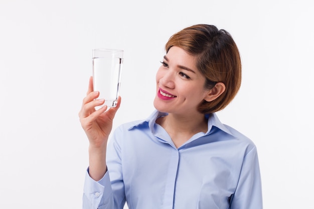 Young Asian woman holding a glass