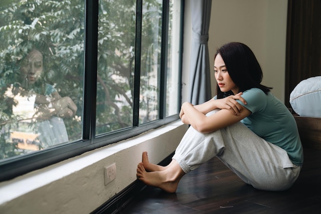 Young Asian woman at home