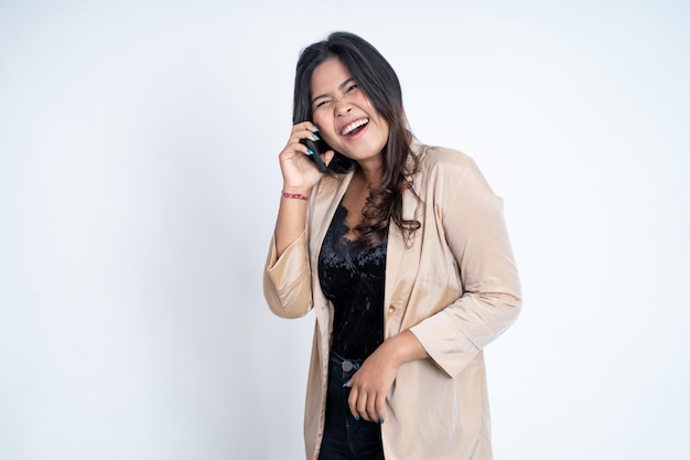 Young asian woman making a call using a cell phone