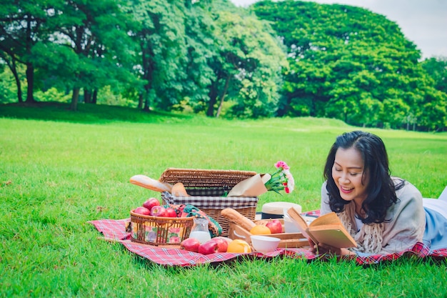 Young Asian woman relax time in park.