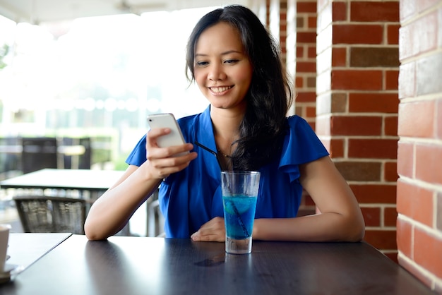 Young asian woman at restaurant