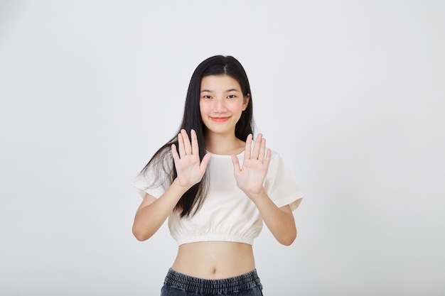 Young asian woman showing two hands stop gesture