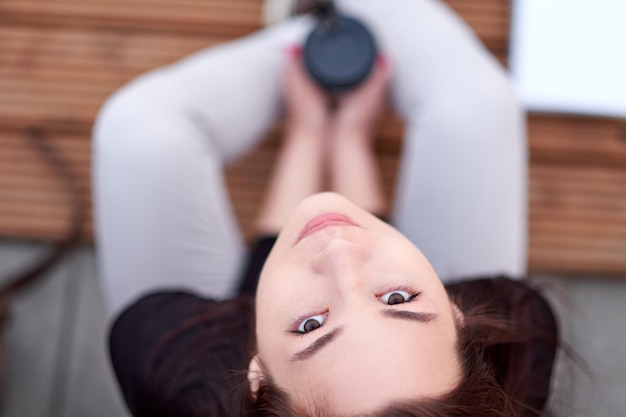 Young asian woman teen with coffee outdoor city portrait