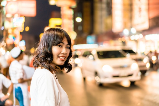 Young Asian Woman Traveler with view at China Town in Bangkok, Thailand