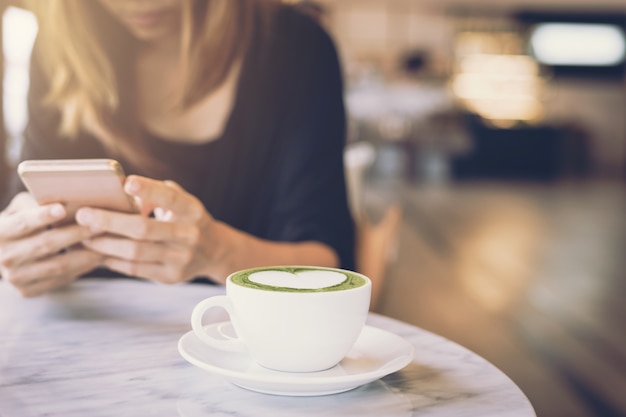 Young asian woman using mobile phone and texting in social network