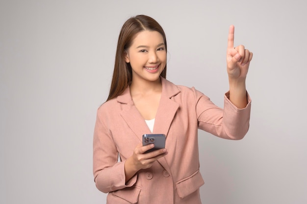 Young asian woman using smartphone over white background technology concept x9x9