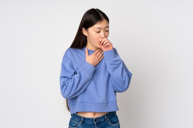 Young asian woman on wall coughing a lot