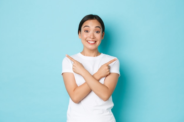 Young Asian woman wearing casual T-shirt posing