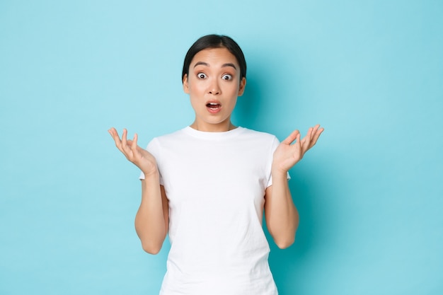 Young Asian woman wearing casual T-shirt posing