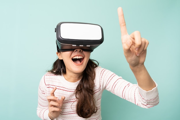 Young asian woman wearing a virtual reality glasses