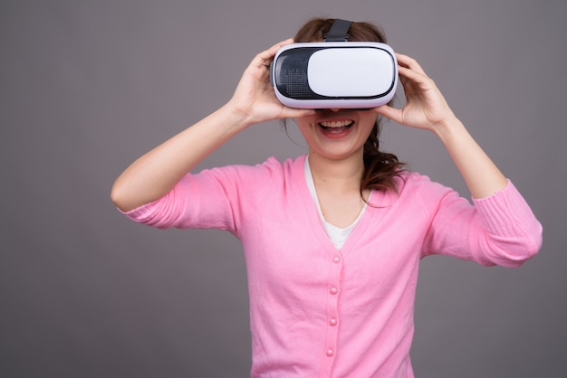 Young Asian woman with virtual reality VR glasses