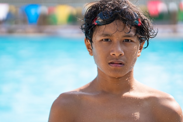 Young asina bot playing at the swimming pool