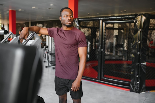 Young athletic African American man in the gym