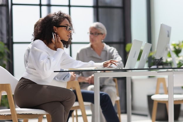 Young attractive african american woman in the office