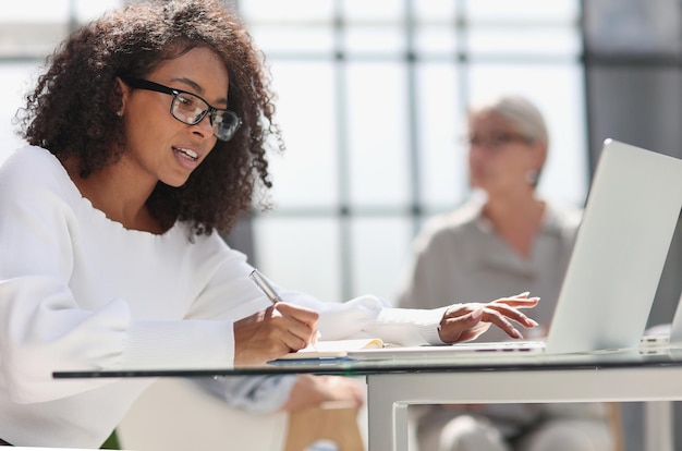 Young attractive african american woman in the office