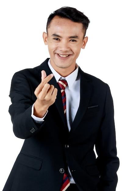 Young attractive asian business man wearing black suit with white shirt and necktie doing the mini heart pose and smiling and looking confident. white background. Isolated