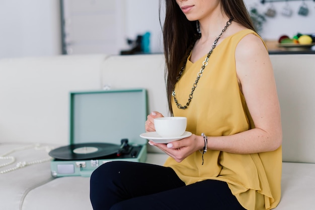 Young attractive european woman to see a smart phone relaxing at home