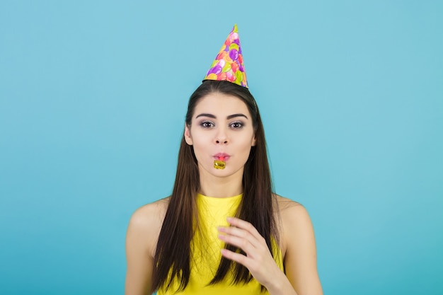 Young attractive smiling woman with a birthday hat