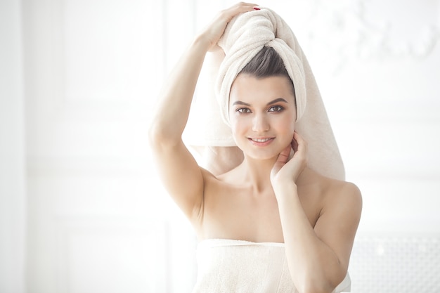 Young attractive woman after bathing in the morning