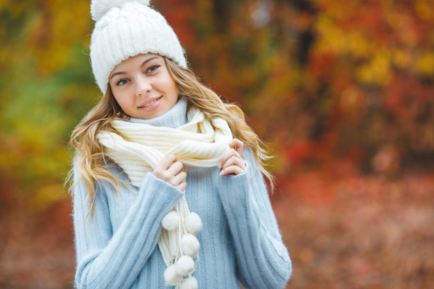 Young attractive woman in autumn colorful background