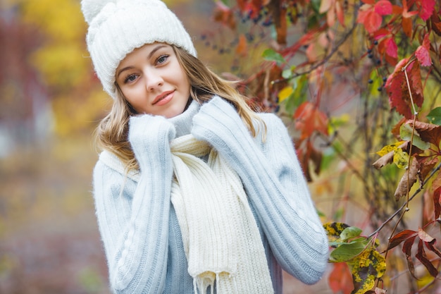 Young attractive woman in autumn colorful background