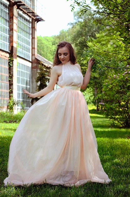 young attractive woman in spring garden. blooming magnolias. Spring background. Lifestyle portrait