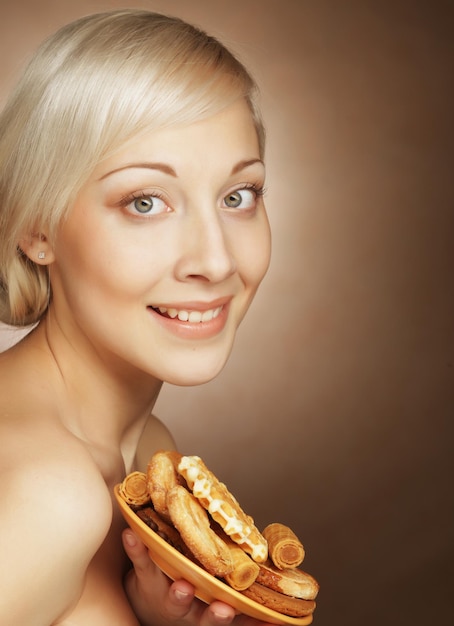 Young attractive woman with cookies