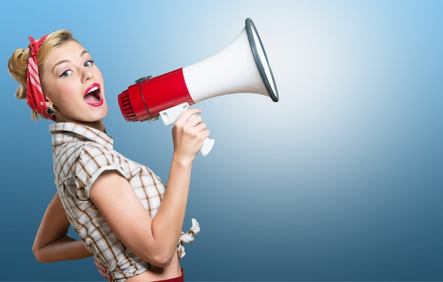 Young attractive woman with loud speaker