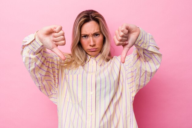 Young australian woman isolated showing thumb down and expressing dislike.