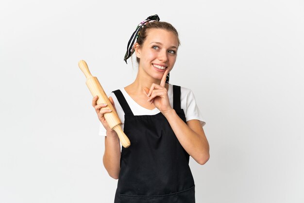 Young bakery woman isolated on white