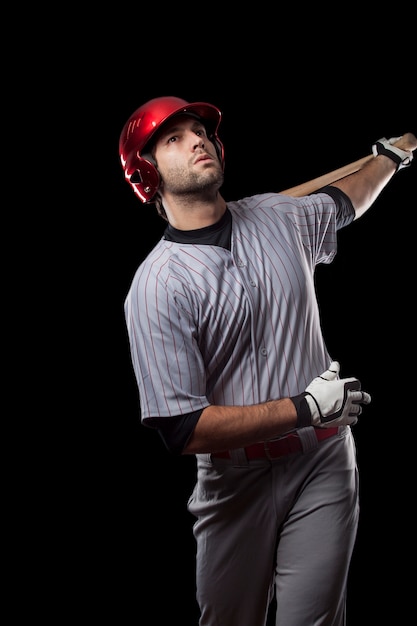 Young baseball player with a red helmet