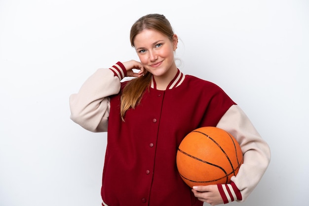 Young basketball player woman isolated on white background laughing