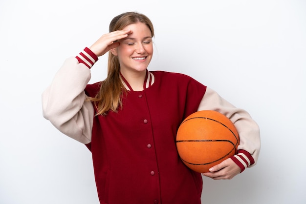 Young basketball player woman isolated on white background smiling a lot