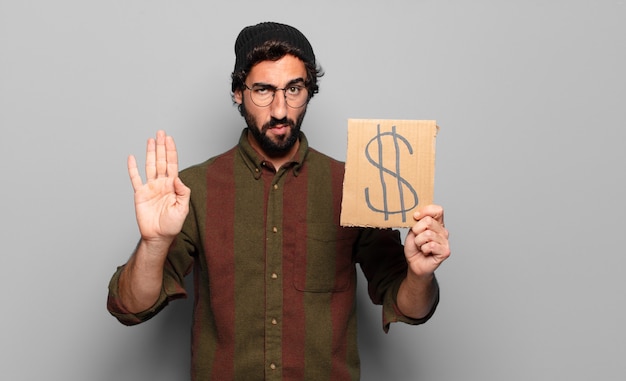 Young bearded man. dollar crisis concept