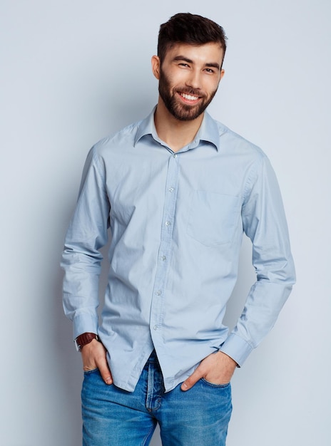 A young bearded man smiling