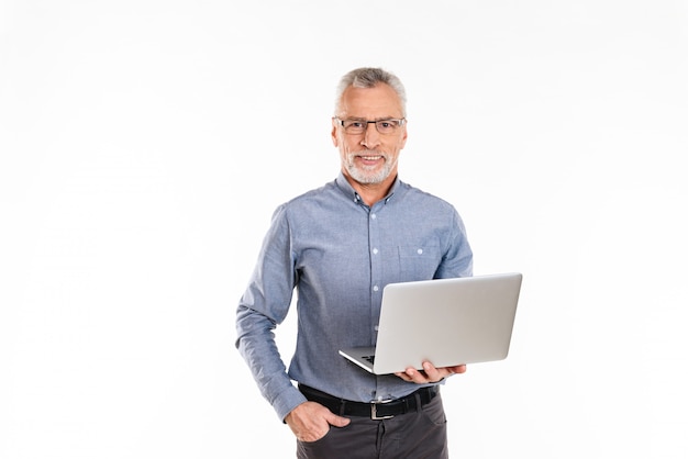 Young bearded old man holding laptop computer and  isolated