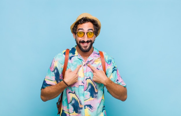 Young bearded tourist man feeling happy